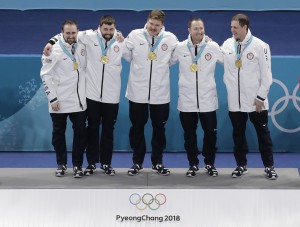 From left, United States' curling team Joe Polo, John Landsteiner Matt Hamilton, Tyler George and skip John Shuster smiles after receiving their gold medals after awarding ceremonies in their men's curling finals match against Sweden at the 2018 Winter Olympics in Gangneung, South Korea, Saturday, Feb. 24, 2018. (AP Photo/Aaron Favila) ORG XMIT: OLYCU123